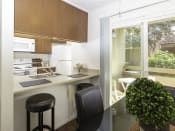 Thumbnail 6 of 34 - Dining and Kitchen Area at Eucalyptus Grove Apartments, Chula Vista, CA, 91910